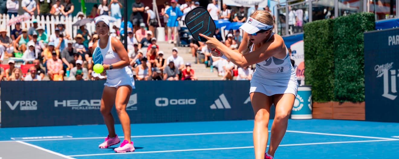 Anna Leigh Waters and Catherine Parenteau competing in women's doubles action.