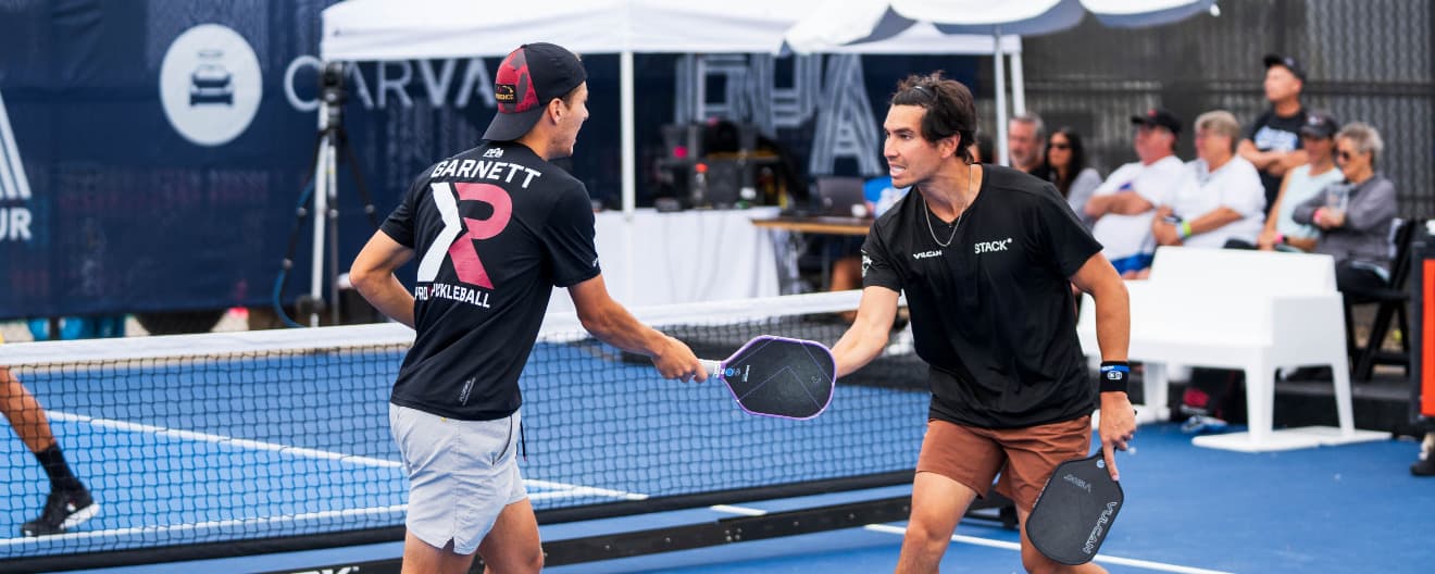 Connor Garnett and Tyler Loong celebrate a point at the Selkirk Kansas City Open.