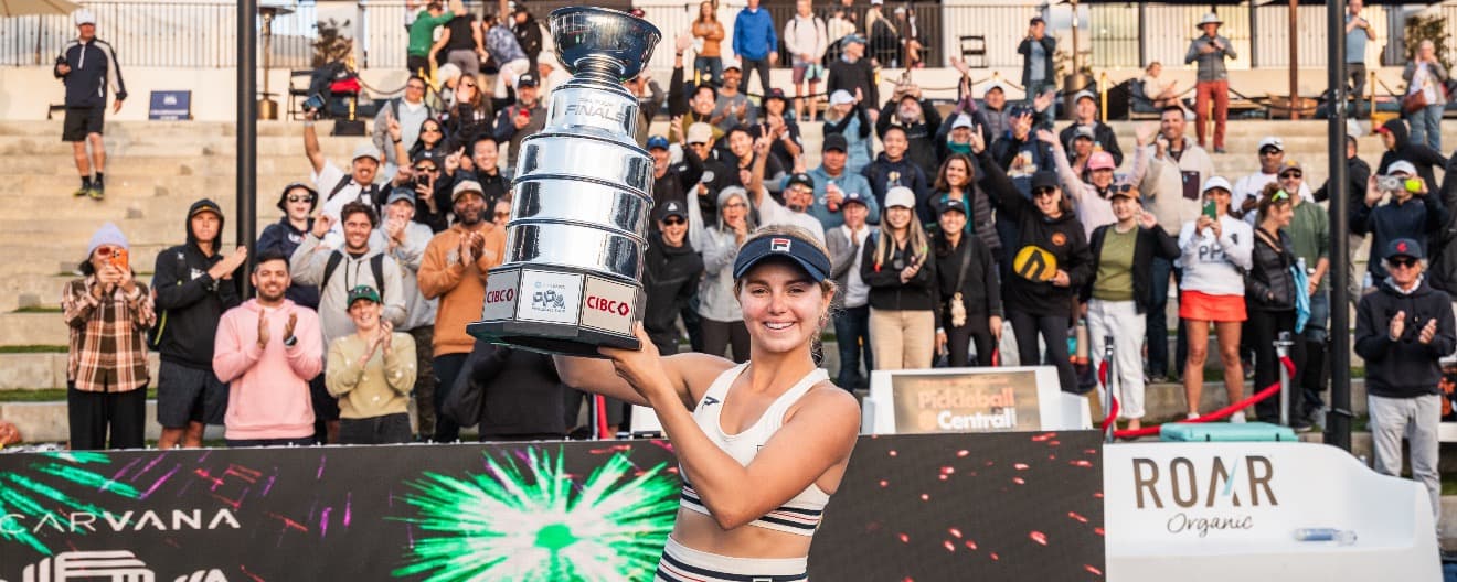 Anna Leigh Waters celebrates with a trophy in Southern California.