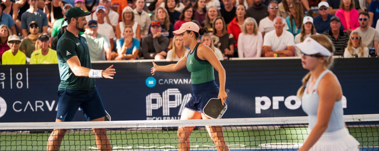 Anna Bright and Dekel Bar celebrate a victory over the top seeds.
