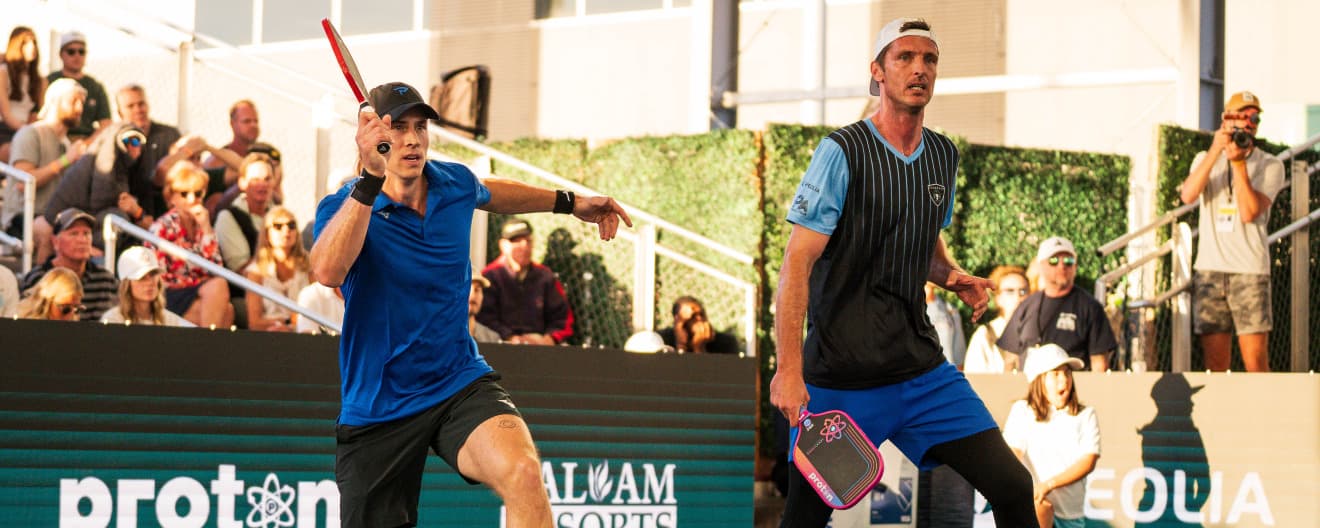Christian Alshon and Andrei Daescu playing men's doubles.