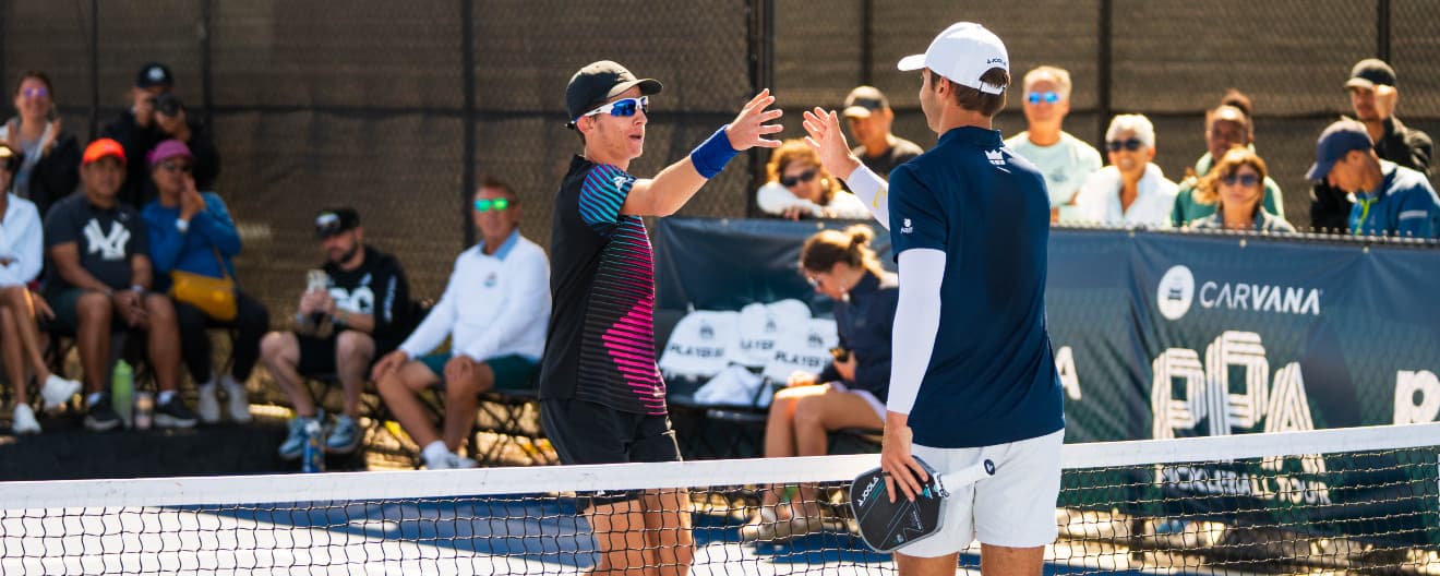 John Goins and Ben Johns shakes hands after a pickeball singles match.