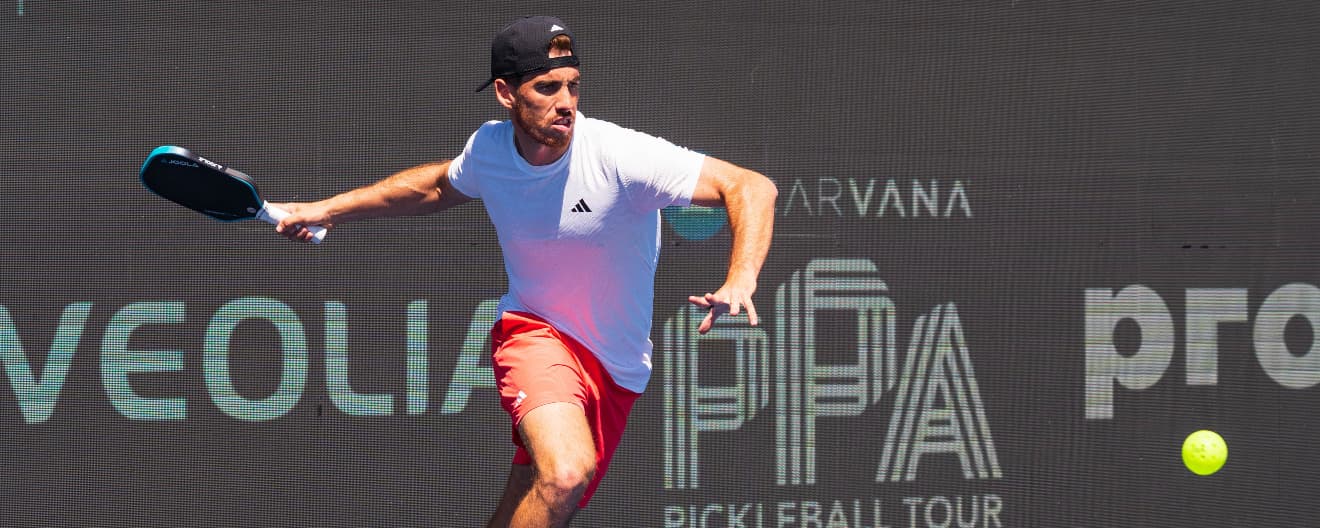 Federico Staksrud hits a forehand.