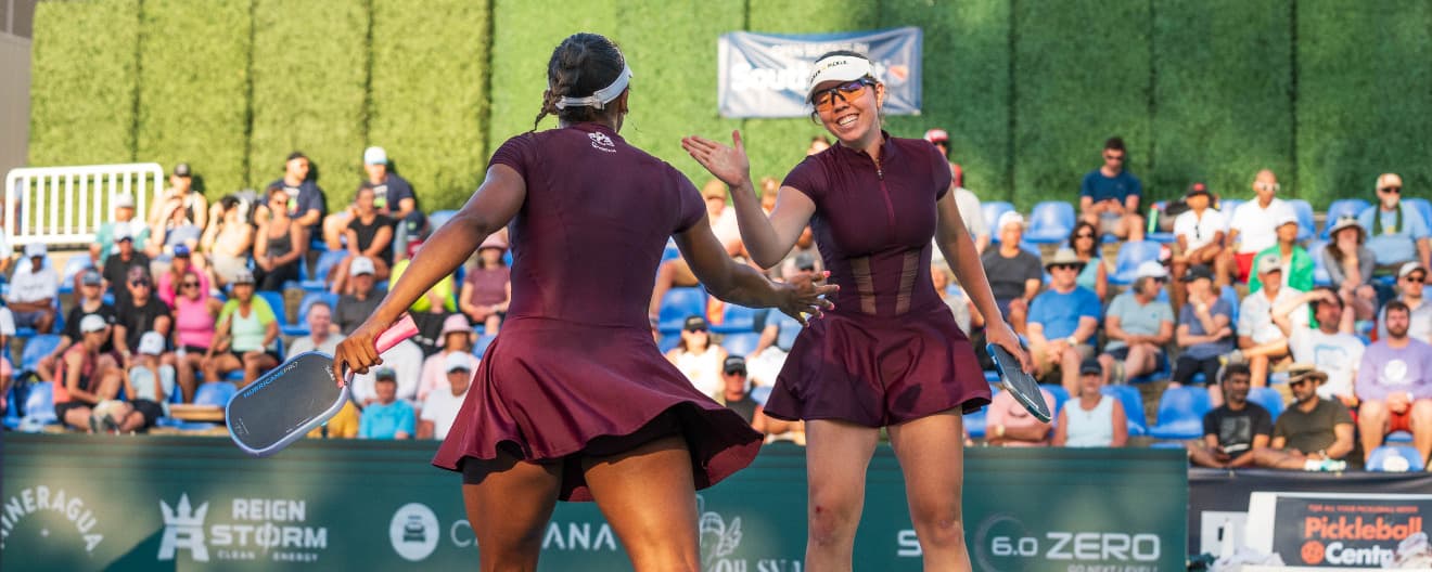 Jorja Johnson and Tyra Black celebrate a point at the Veolia North Carolina Open.