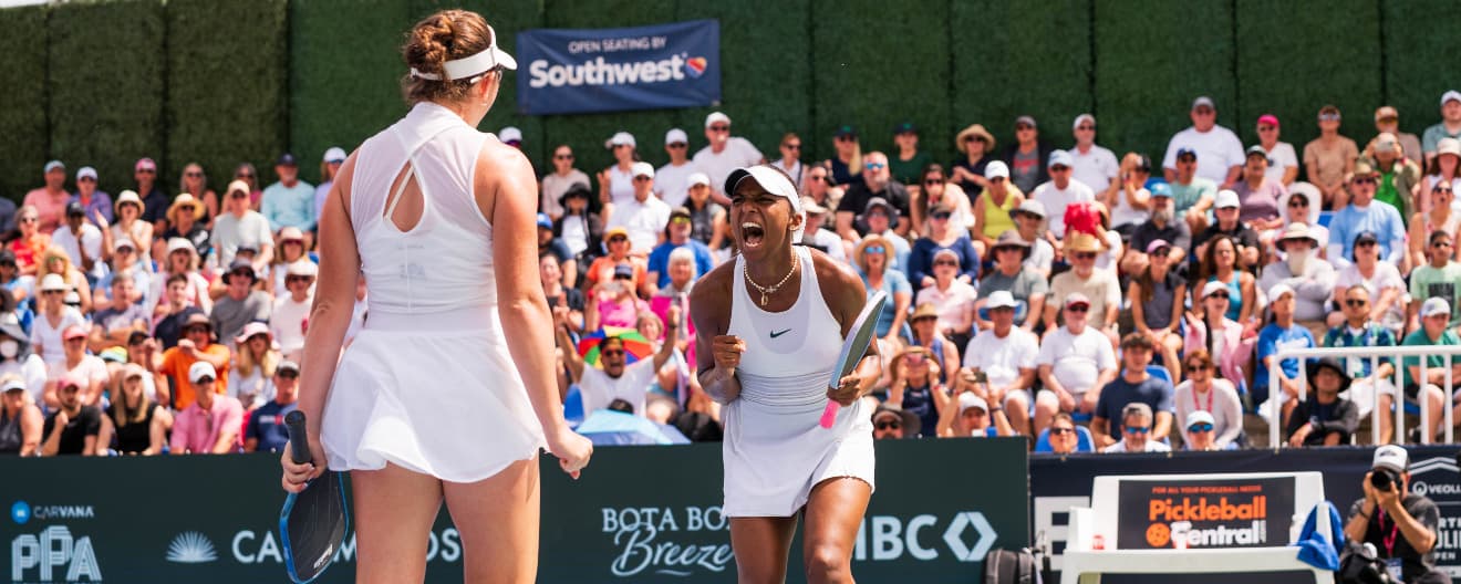 Tyra Black and Jorja Johnson celebrate their women's doubles title at the Veolia North Carolina Open.