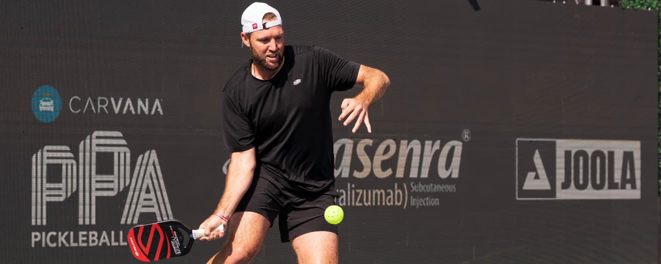 Jack Sock hitting a pickleball forehand.