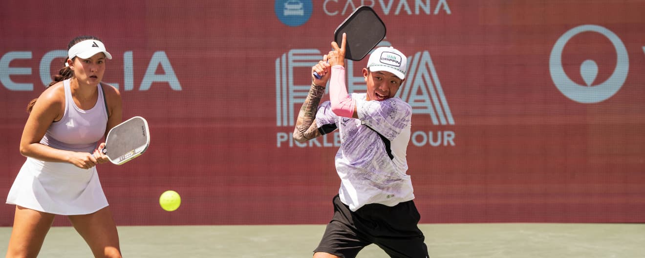 Anna Bright and Quang Duong playing pickleball mixed doubles.