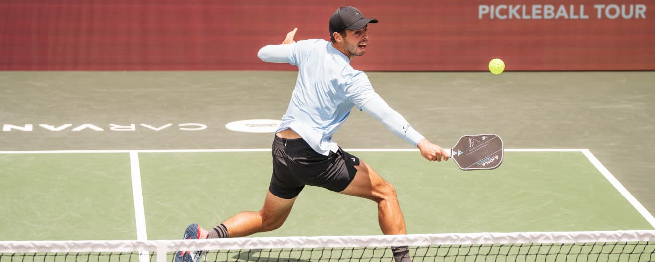 Ben Johns hitting a backhand volley.