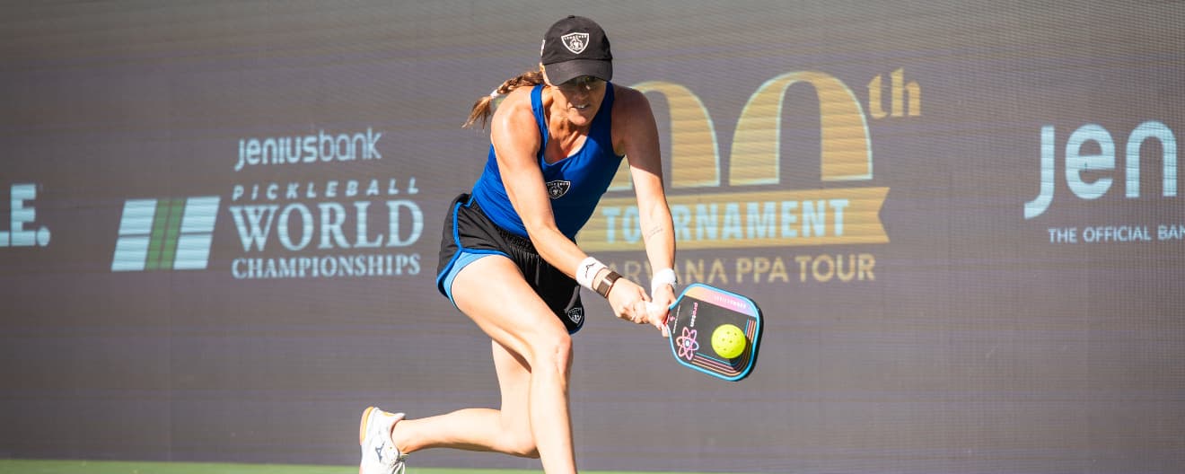 Kaitlyn Christian hitting a pickleball backhand.
