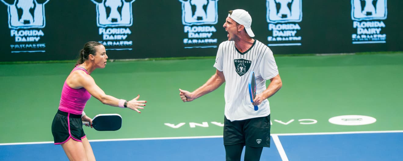Kaitlyn Christian and Andrei Daescu celebrating their victory at the Florida Dairy Farmers Daytona Beach Open.