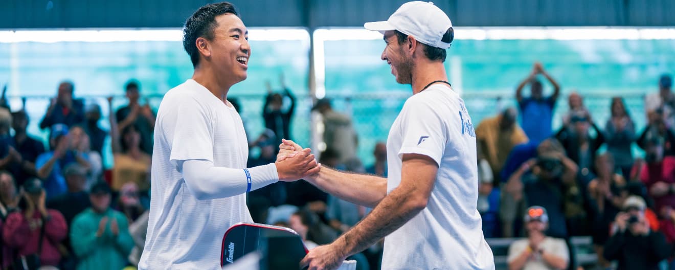 Augie Ge and JW Johnson celebrating their men's doubles title.