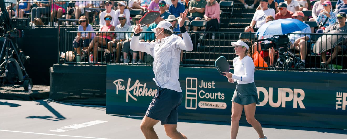 Christian Alshon hitting a pickleball serve.