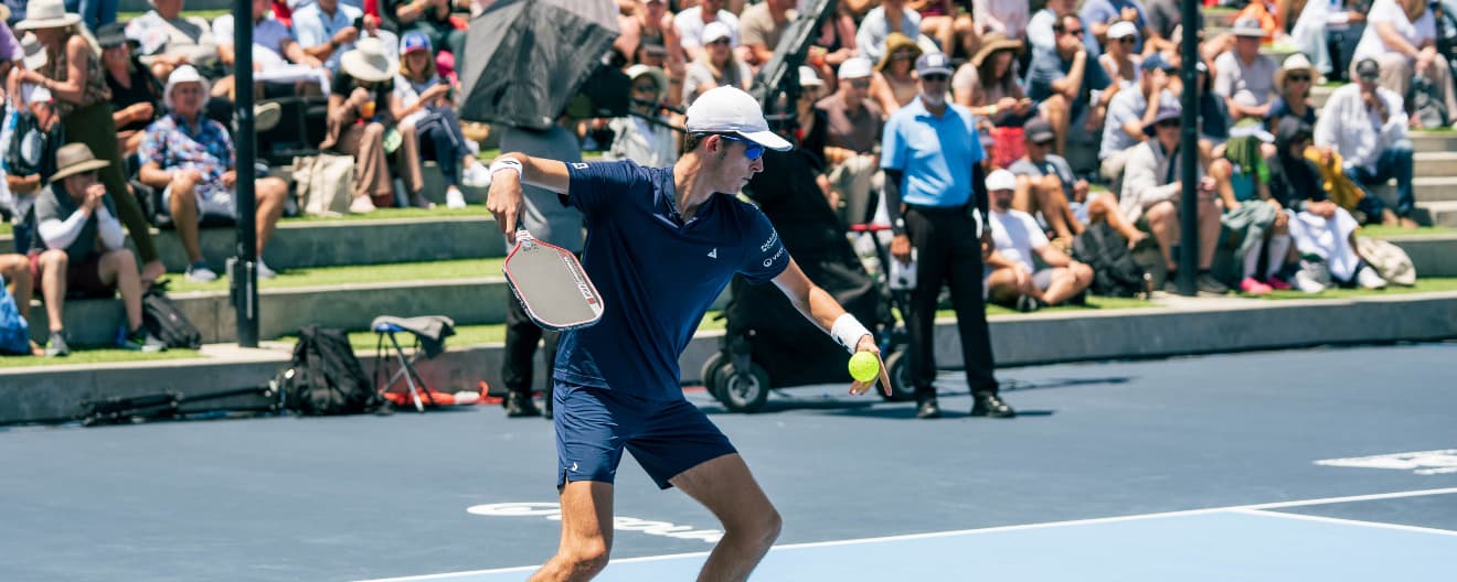 John Lucian Goins hitting a serve at the Toys "R" Us PPA Finals.